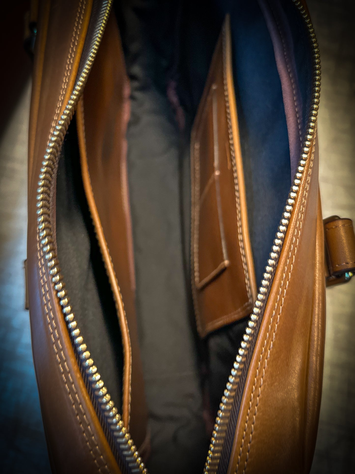 Interior of Vachetta leather briefcase showing Cordura lining and laptop sleeve