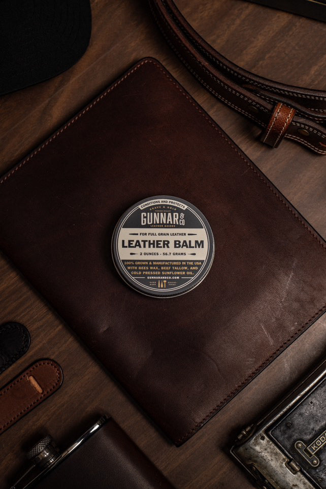 Gunnar & Co. Leather Balm on wooden surface — perfect for restoring full grain leather goods.