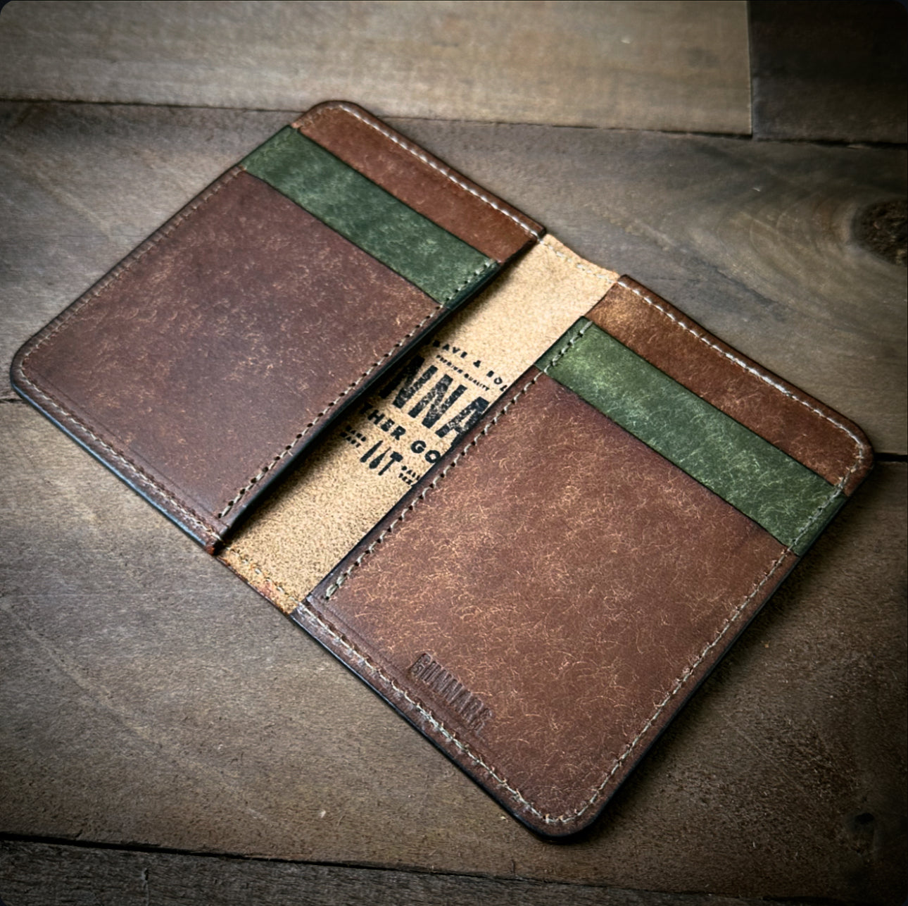 Open leather wallet showing card slots and bills - minimalist front pocket design
