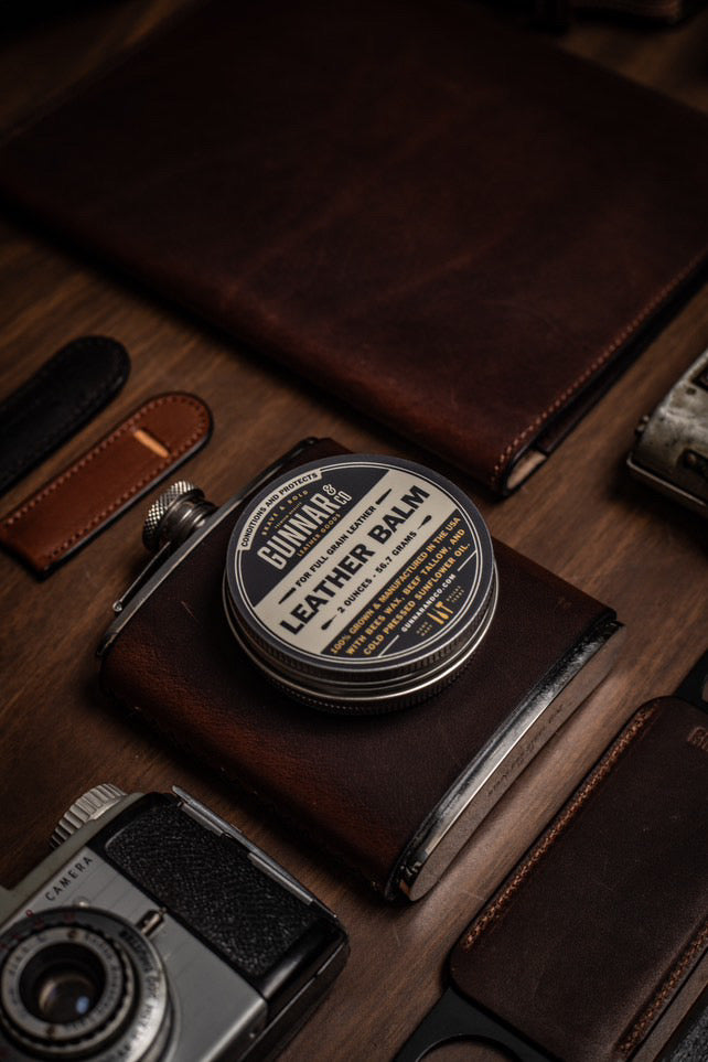 Open tin of Gunnar & Co. Leather Balm showing natural beeswax and tallow texture.